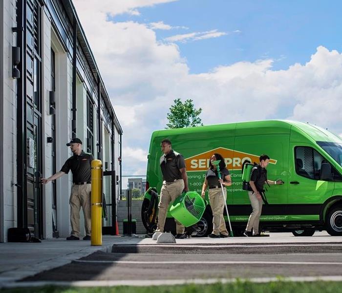 A SERVPRO Crew begins to set equipment outside of a job. 
