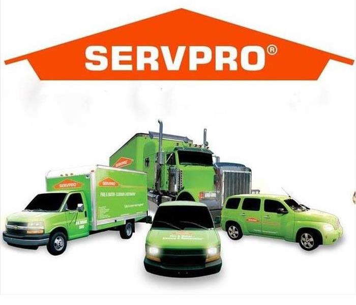 SERVPRO logo with 4 green vehicles